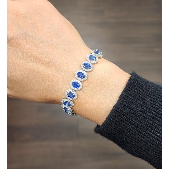This stunning bracelet showcases 12.40 carats of oval blue Ceylon sapphires, each stone carefully matched for color and...