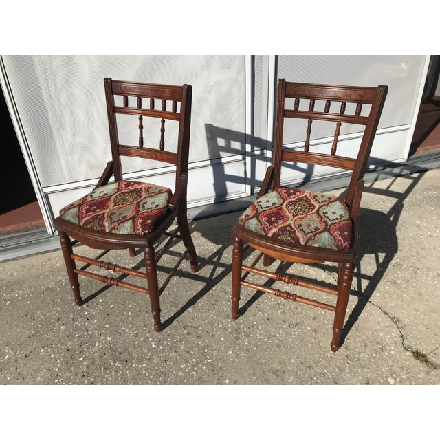 This is a pair of vintage armless dining chairs or bedroom chairs. The seats were re-covered at some point along the way....