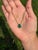 This delicate 3.88 carat pear-cut emerald pendant necklace is crafted in 14K yellow gold. The stone measures about 12.3 x...