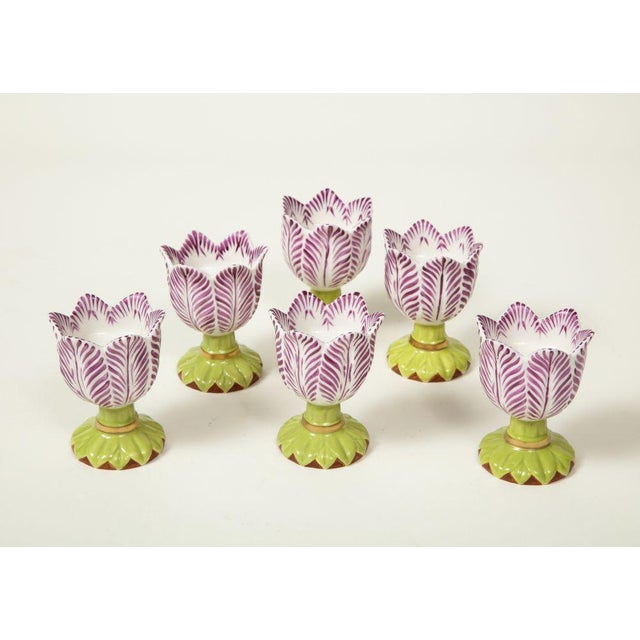 After 18th century models; each decorated with red petals and a green base. Sold individually.