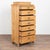 Mid 19th century Danish highboy chest, crafted in pine. This narrow chest features seven drawers and a traditional curved...