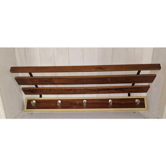 Vintage Wall-Mounted Coat Rack with Teak Wood Struts and Aluminum Hooks, 1970s, in Very Good conditions. Designed 1970 to...