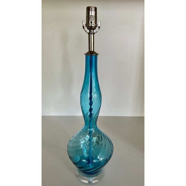 Curvaceous Murano glass lamp blown in the 1960s in MEDIUM BLUE. Diagonal ribs, though subtle, provide wonderful optics. It...