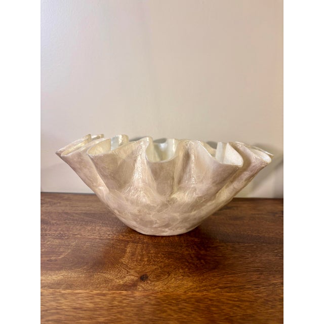Beautiful coastal capiz shell bow with ruffled edges. Beautiful figured shape with excellent optic texture created by the...