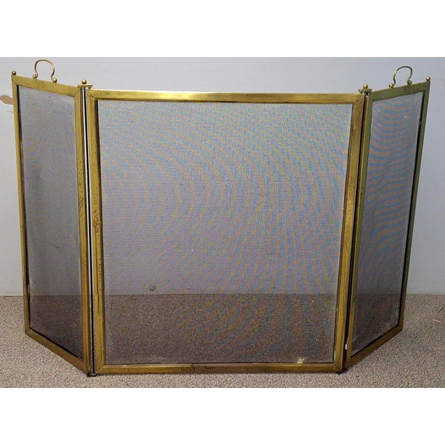 A Victorian period Solid Brass and Wire Mesh Fire Screen , Circa 1880s It measures 50" in width fully open, 28" in width...