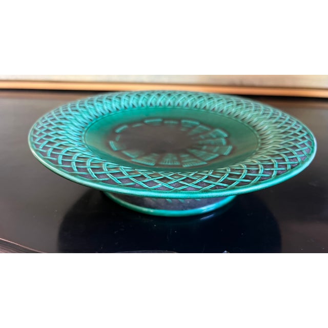 Hand painted vibrant green majolica low footed compote made in England by Minton, date stamped to 1860. The plate has a...