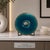A signed mid-century enamel on copper bowl by artist Sally de Paoli, featuring a charming fish motif against a vibrant...