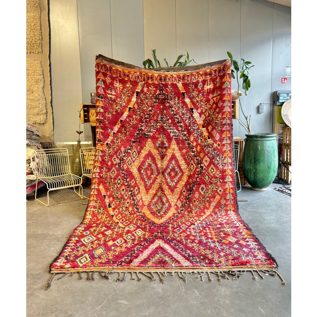 This impressive vintage Beni M’Guild rug is a powerful example of Moroccan tribal craftsmanship. Handwoven in the Middle...