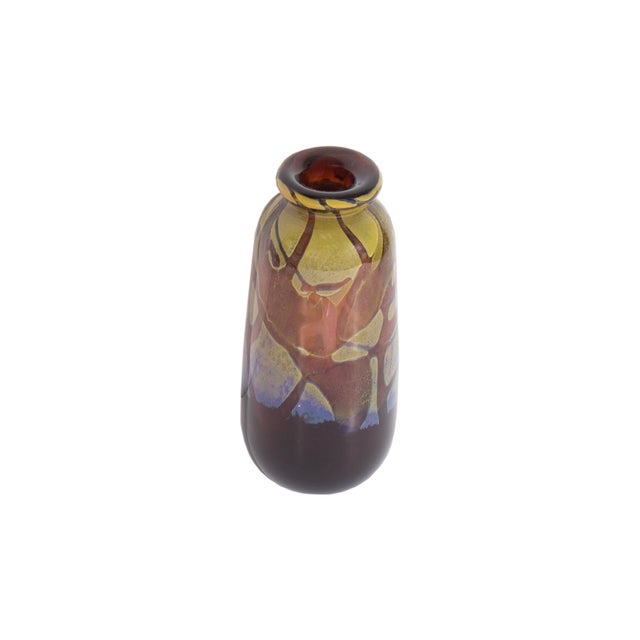 An art glass vase by American glass artist Donald Carlson. Signed verso, this vessel embodies a flared cylinder shape and...