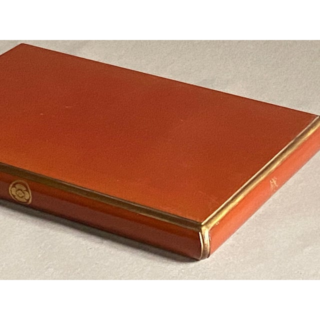 Coral red lacquered base (Urushi lacquer) delicately accented with gold. A magnificent base for displaying a valuable object.