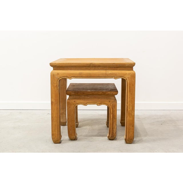 Pair of Chinese tables with solid elm wood finishings. Their proportions allow to keep one inside the other as the nest...