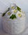 Please, don't eat the daisies! But feel free to use this round basket weave white ceramic jewelry box with dimensional...