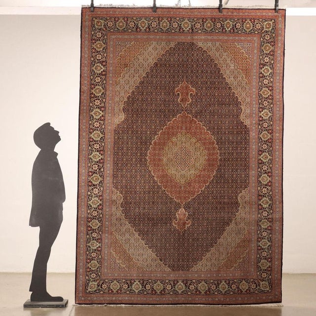 Tabriz rug in cotton and fine node wool, manual manufacture. This piece is attributed to the mentioned designer/maker. It...