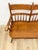 This handsome vintage solid maple spindle two-seat bench is a beautifully crafted and characterful seating find. The warm...