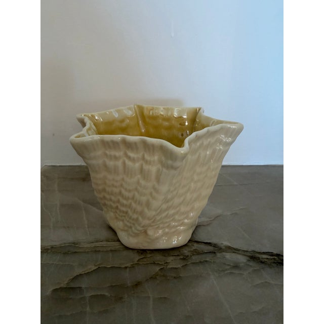 Charming and delicate, this small, opalescent, cream-colored Belleek Limpet twirl form vase is perfect for an everyday...