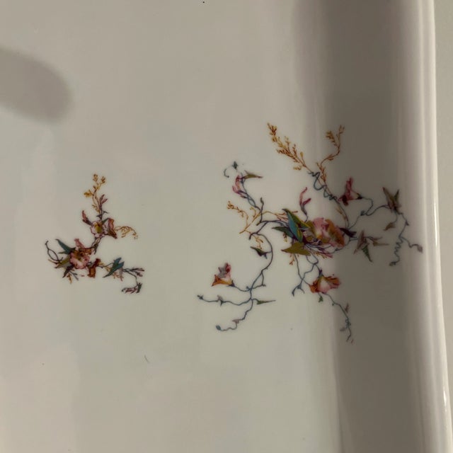 Serving platter 13” x 9”. This is Haviland pattern H1252. It is a beautiful free form floral design in pinks and teals.