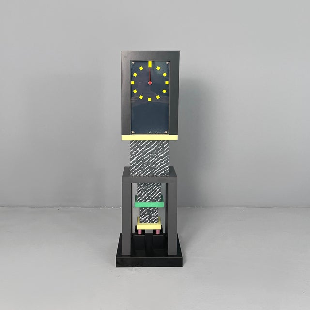 Italian modern table clock Metropole by George J. Sowden, 1982 Metropole table clock made of wood covered in colored...
