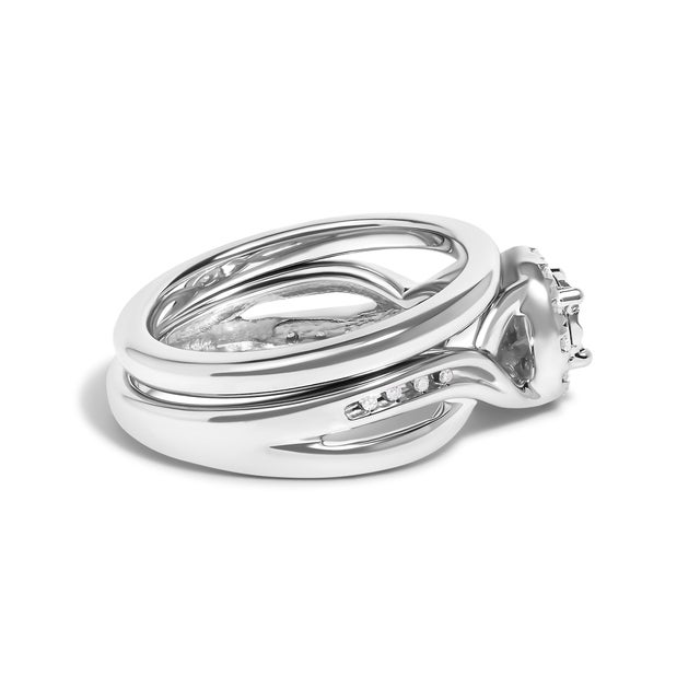 Immerse yourself in the allure of timeless elegance with this exquisite .925 sterling silver engagement and wedding band...