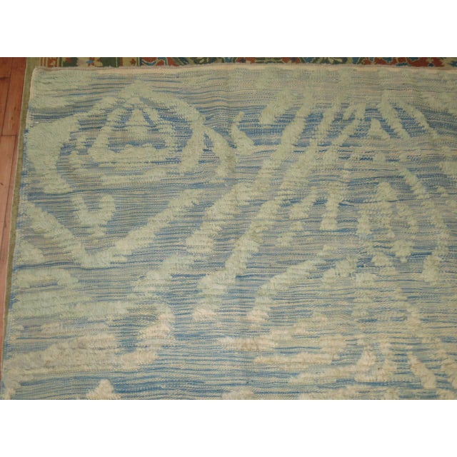 A Turkish flat-weave woven with old long pile Turkish wool. Sky blue abashed background predominantly in ivory accents and...