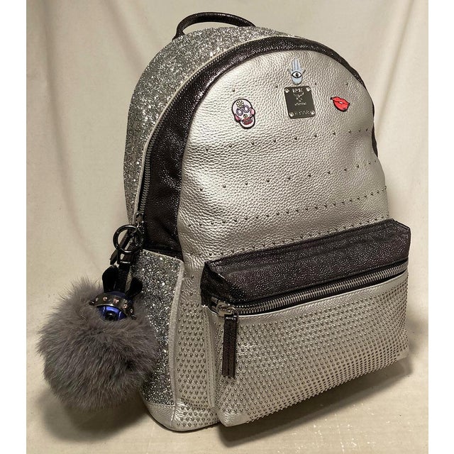 MCM Special Edition Silver Leather Swarovski Crystal Backpack with Rabbit Charm in excellent condition. Silver leather...