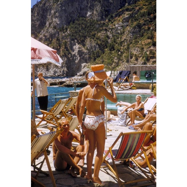 Capri Hat by Toni Frissell Description Friends bathe in the sun on the coast of Capri, 1959. (Photo by Toni Frissell)...