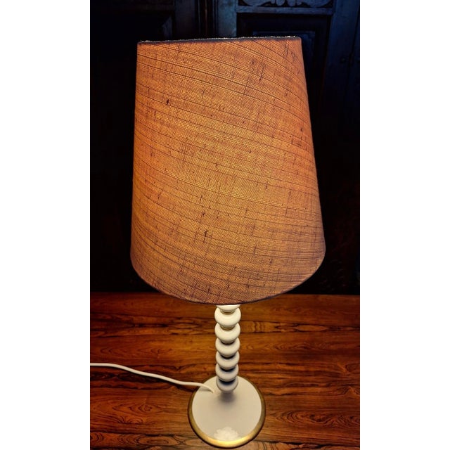 Tall and elegant high quality mid-century Italian table or desk lamp with stacked porcelain spheres separated by gold-...