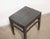 A handsome vintage Chinese stool crafted from solid elmwood, dating to the first half of the 20th century. The rectangular...