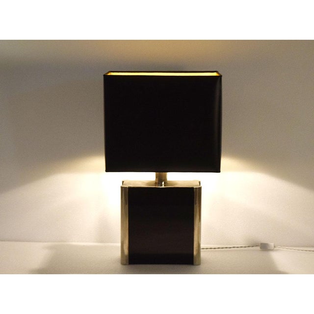 Romeo Rega 1970s table lamp. Silver-plated metal and black acrylic glass base, rigid lampshade made of crtaceous material...