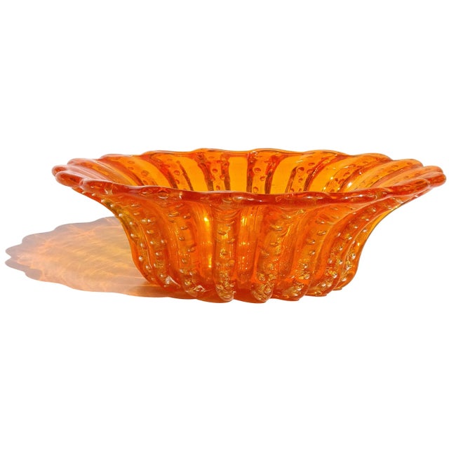 Beautiful vintage Murano hand blown orange and gold flecks Italian art glass scrapped rim bowl. Documented to designer...