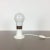 Table light with glass bulb shade Origin: Italy Age: 1970s Description: Original 1970s glass bulb table light. The base...
