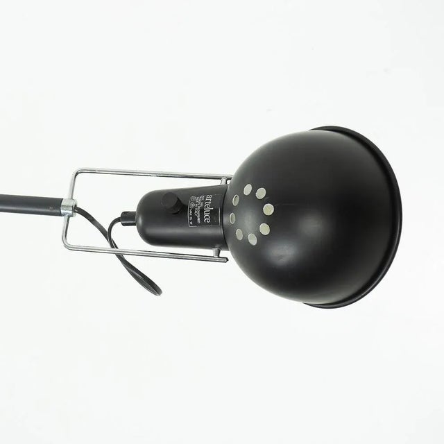 An Early pre-Flos model 265 counter balance wall lamp in black metal by Paolo Rizzatto; the lamp can rotate into many...