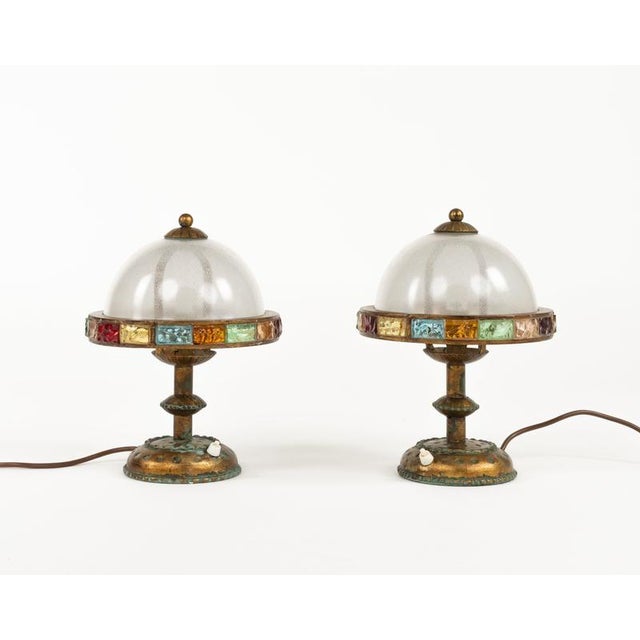 Midcentury amazing pair of table lamps in golden wrought iron and multi-color hammered glass produced by Longobard the...