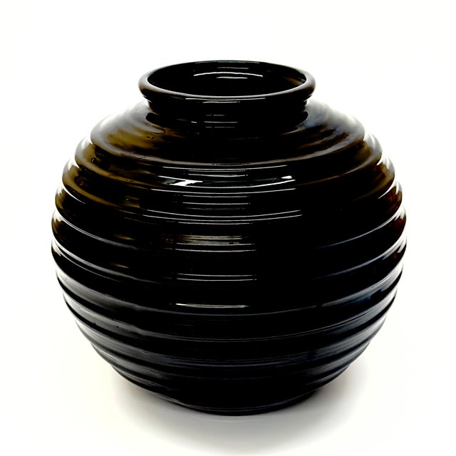 This is a gorgeous, rare 1980s monumental spherical glossy black ribbed ceramic vase by Haeger, style 4340, featuring a...