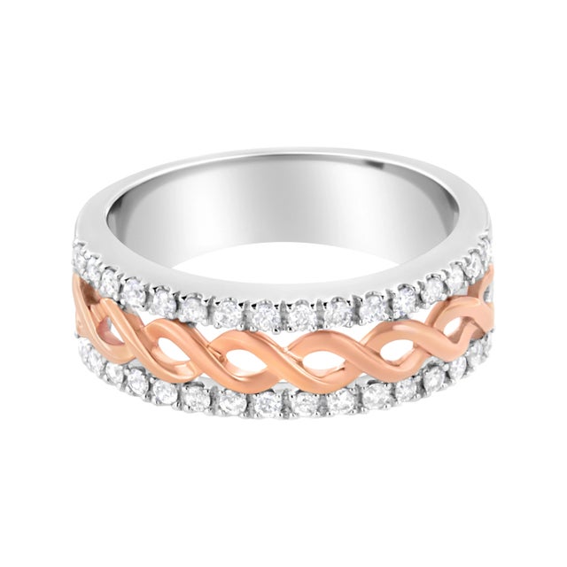 You will love this uniquely designed split shank ring in gleaming 10k white gold. A central infinity ribbon motif in 10k...