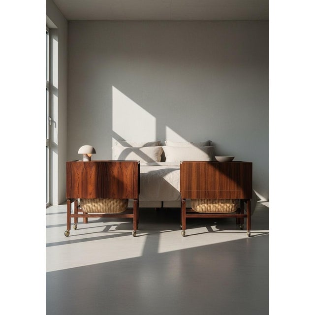 Pair of danish sewing tables attributed to erling torvits and produced during the 1960s. executed in rosewood with lower...