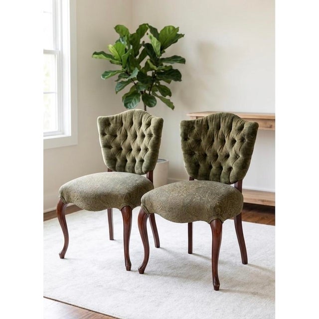 A gorgeous, compact vintage French-inspired accent chairs. It features an elegantly tufted olive green velvet backrest...
