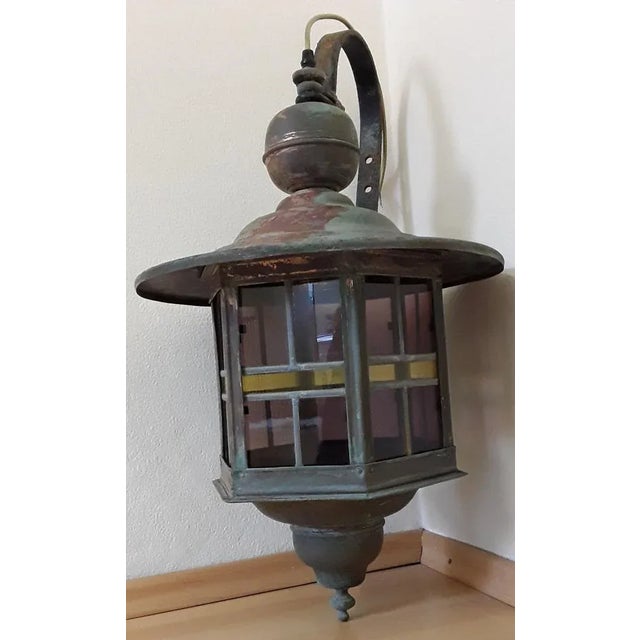 Vintage Wall Lantern with Copper Housing with an Iron Arch Holder, 1930s, in Good conditions. Designed 1920 to 1949 Up to...