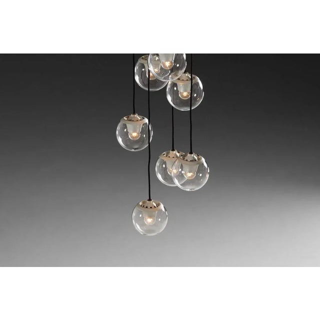 A nice and visually striking chandelier, model 2095/9, designed by the legendary gino sarfatti and produced by arteluce,...