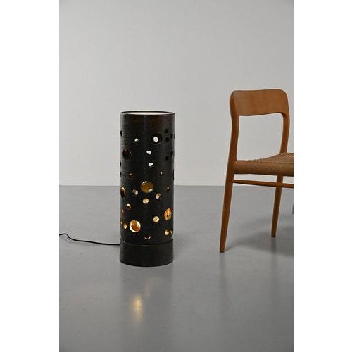 Ceramic floor lamp with round perforations. If you really want to have a piece no one else has, this is your chance. A...