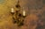 Hollywood Regency gilt metal wall sconce, circa 1950s. Elegant two-light wall sconce crafted in gilt metal, featuring...