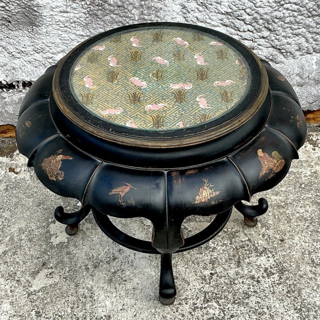 Bring elegance and artistry to your space with this vintage Asian Chinoiserie bat wing coffee table. Featuring a striking...