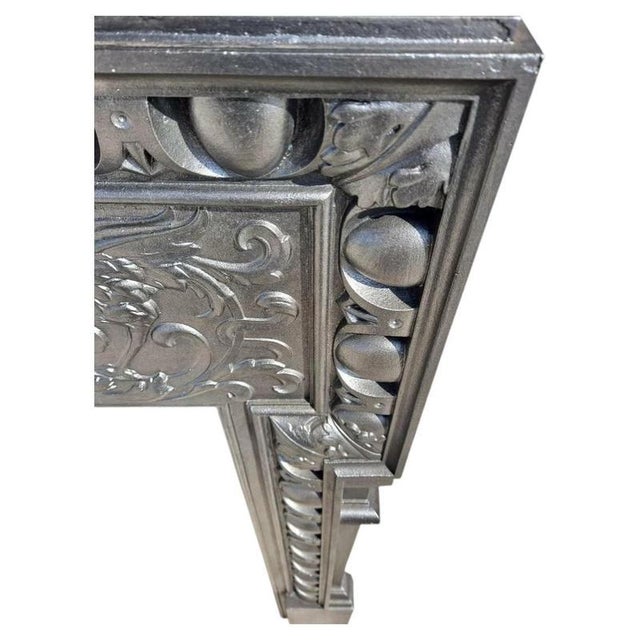 A magnificent and unusually tall antique victorian cast iron fireplace surround, reclaimed from a period property in...