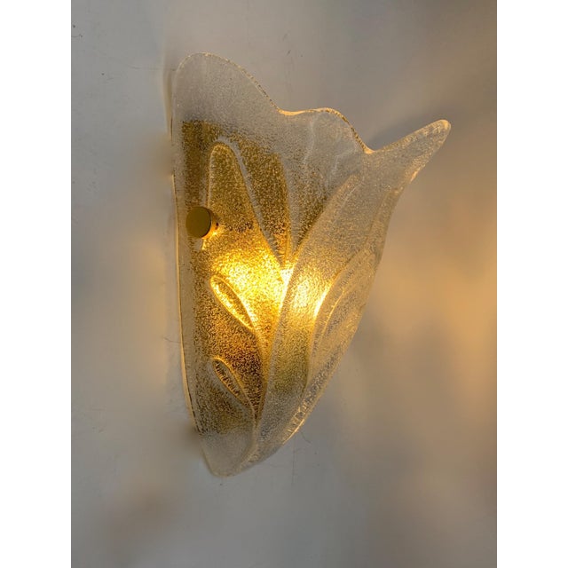 Fantastic pair of handcrafted wall lights with murano glass; lamp created with the collaboration of the murano masters....
