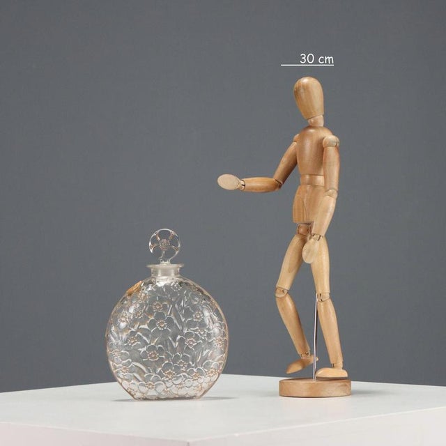 Le Lys' perfume bottle designed by René Lalique for the Maison D'Orsay around 1922, featuring a molded and shaped glass...