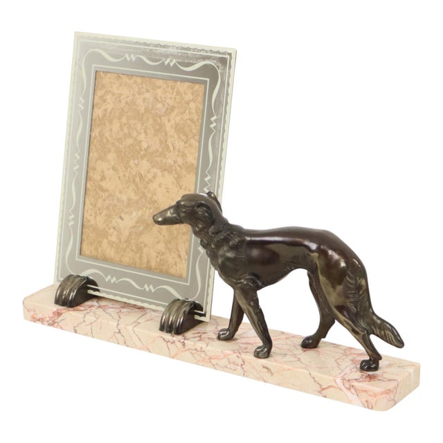 A magnificent, large photo frame—a rare and authentic Art Deco piece. The base is crafted from pink-tinted marble and...