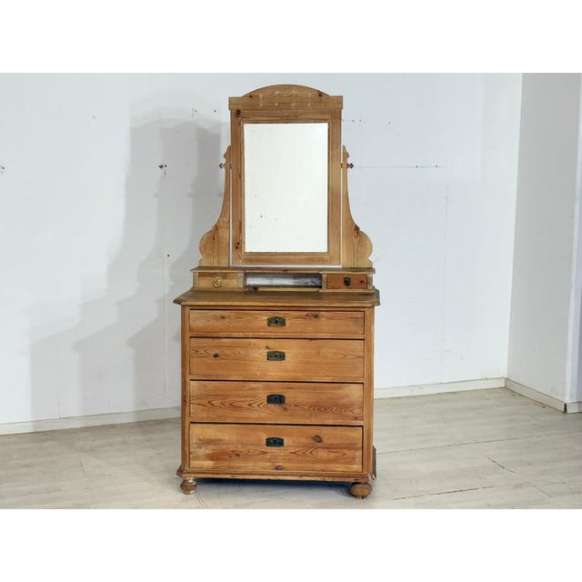 For sale is this charming antique dressing table made of solid softwood, which lends a cozy, nostalgic atmosphere to any...