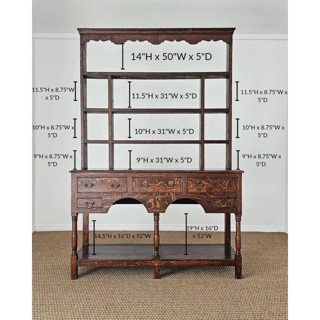 A striking antique oak dresser featuring a classic open plate rack above a generous dresser base. Rich oak grain, turned...