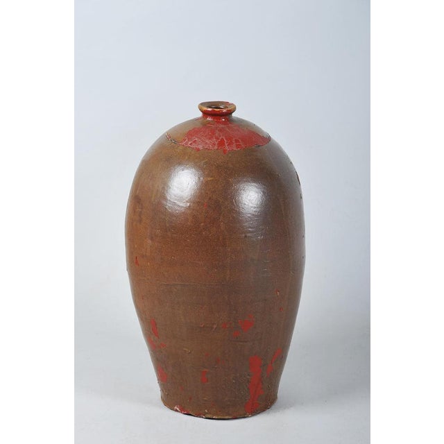 This ceramic vase originates from early 20th-century Czechoslovakia and stylistically bears elements of Art Deco...
