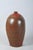 This ceramic vase originates from early 20th-century Czechoslovakia and stylistically bears elements of Art Deco...