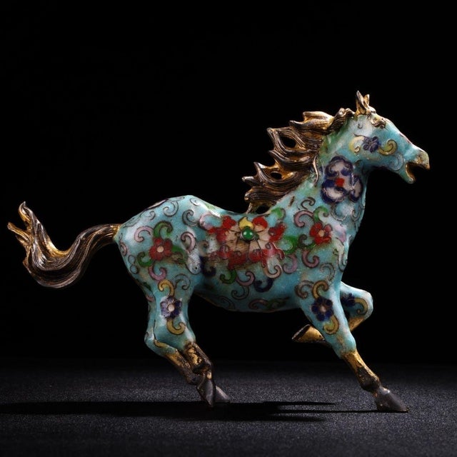 This is a beautiful antique cloisonné enamel horse figurine, captured in a dynamic, prancing pose with its front right leg...